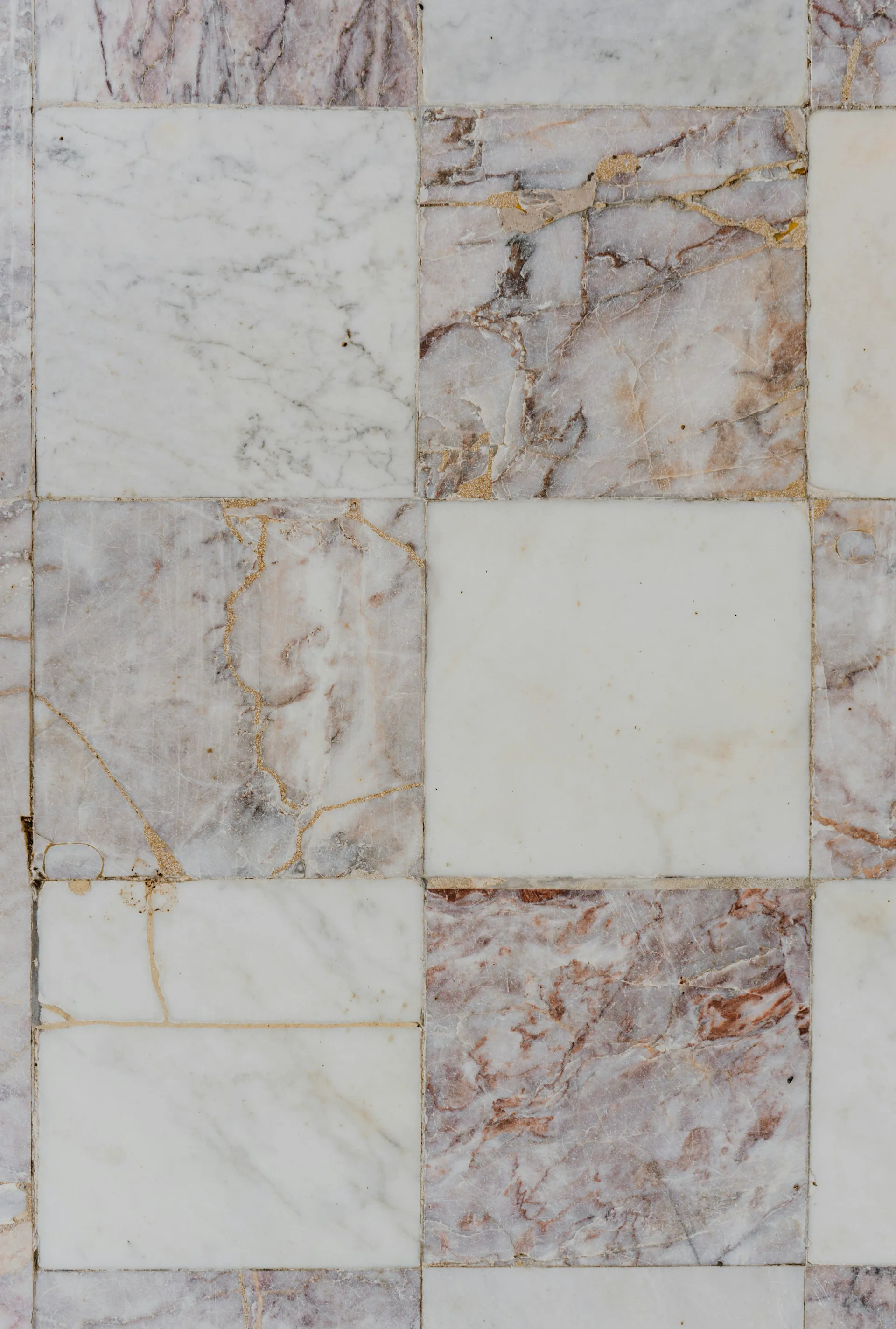 Close-up of marble tile installation showcasing intricate patterns and textures